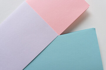pink, lavender, and blue paper background