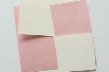 background with pink and ivory white squares (rectangles)