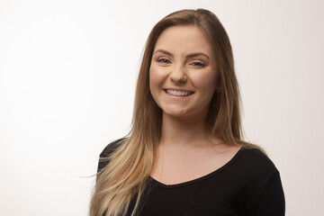 Young blonde woman isolated in studio portrait