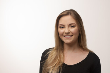Obraz premium Young blonde woman isolated in studio portrait