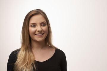 Young blonde woman isolated in studio portrait