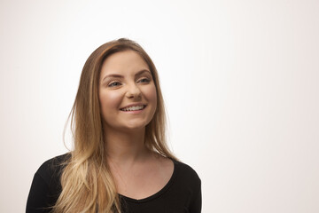 Obraz premium Young blonde woman isolated in studio portrait