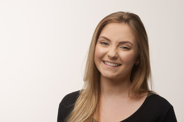 Young blonde woman isolated in studio portrait