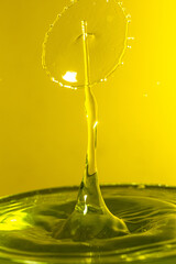 splash photography with yellow liquid
