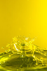 splash photography with yellow liquid