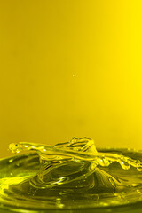 splash photography with yellow liquid