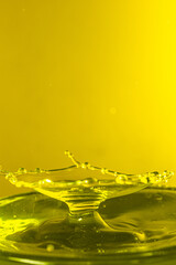 splash photography with yellow liquid