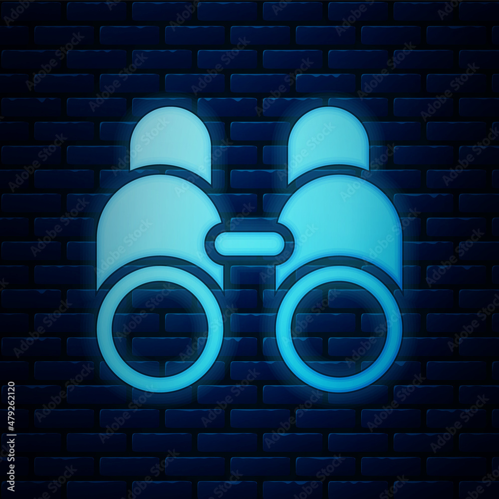 Wall mural Glowing neon Binoculars icon isolated on brick wall background. Find software sign. Spy equipment symbol. Vector