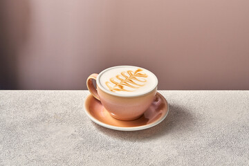 cappuccino with pink cup on white background