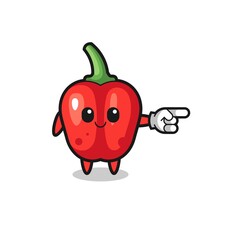 red bell pepper mascot with pointing right gesture