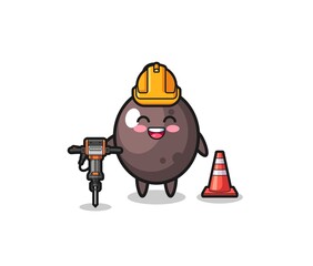 Obraz premium road worker mascot of black olive holding drill machine