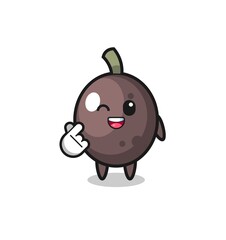 black olive character doing Korean finger heart