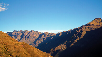 mountains in the morning with a clear blue sky