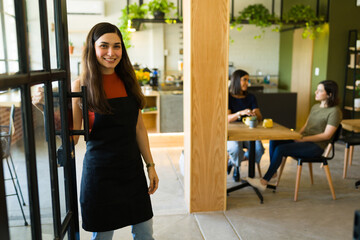 Waitress greeting customers at the restaurant