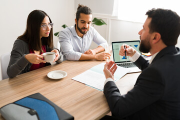 Young couple meeting a finance consultant