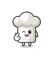chef hat character doing Korean finger heart