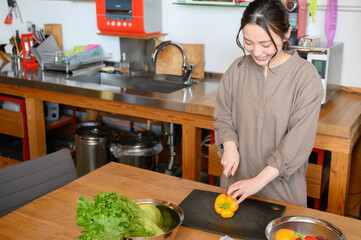 Woman cooking in the kitchen Copy space