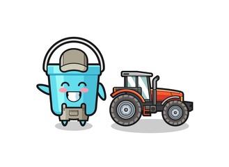 the plastic bucket farmer mascot standing beside a tractor.
