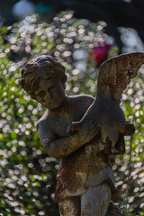 statue of angel with a cross