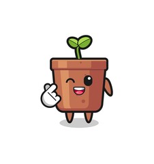 plant pot character doing Korean finger heart