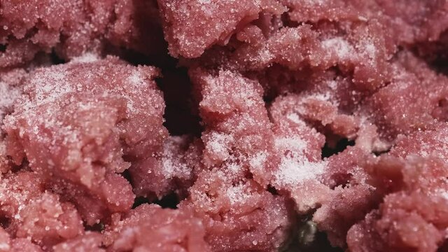 Close-up View, Seasoning Minced Meat With Salt, Adding Salt to Minced Turkey Meat - Steady Shot