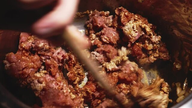 Mixing Minced Meat With Spices, Stirring Using a Pot Spoon, Cooking Delicious Pasta Bolognese - Steady Shot