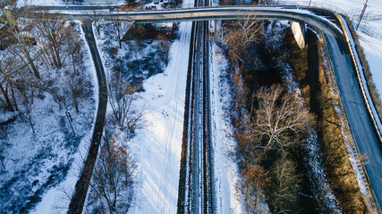 Train tracks bridge pal baseball field aerial top down snowy view