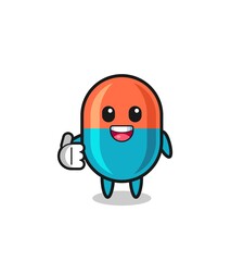 Obraz premium capsule mascot doing thumbs up gesture