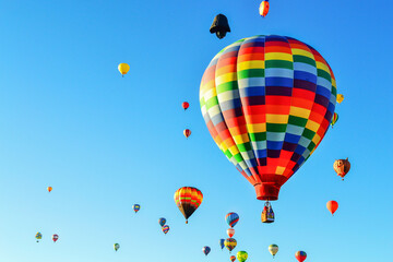 A lot balloons, hot air flying in the blue sky. Festival balloons, hot air Mexico.