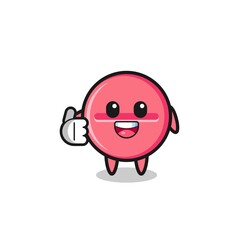 medicine tablet mascot doing thumbs up gesture