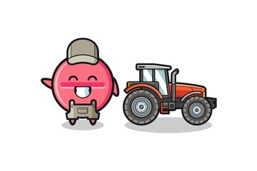 the medicine tablet farmer mascot standing beside a tractor