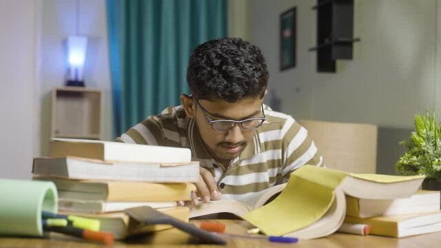 Young student suffering understanding from book while reading or studying for examination - concept of confusion, weak phonemic awareness and struggling to study