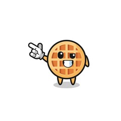 circle waffle mascot pointing top left