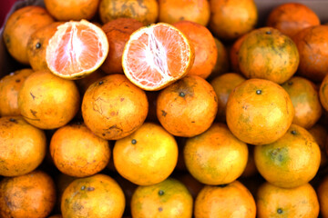 Fresh tropical oranges in street food in tropical market of Thailand.