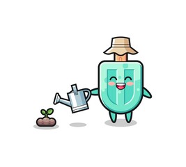 cute popsicles is watering plant seeds