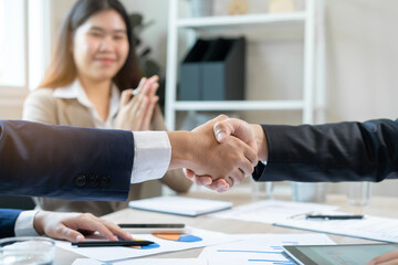 Congrats, business partnership people, asian happy young businessman handshake, shaking hands with partnership, customer or colleague after finishing successful meeting, good deal. People working.