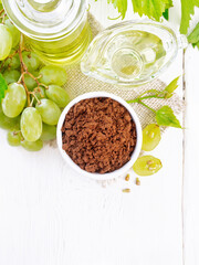 Flour grape seed in bowl on light board top