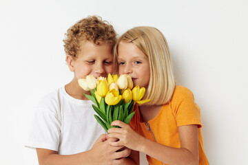 Fototapeta na wymiar cheerful children fun birthday gift surprise bouquet of flowers isolated background unaltered