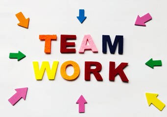 Arrow marks with the word Team Work with a white background