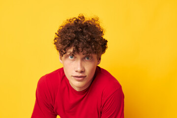 Fototapeta na wymiar Young curly-haired man summer style fashion posing isolated background unaltered