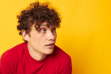 portrait of a young curly man summer style fashion posing isolated background unaltered