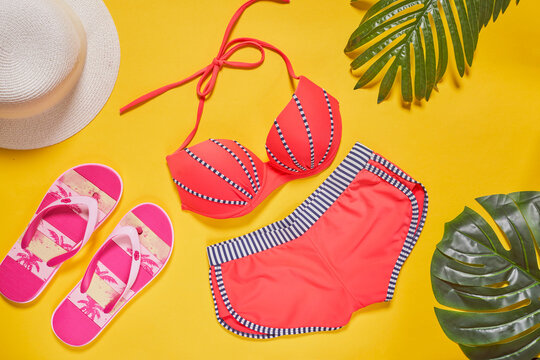 Beautiful female's bikini, straw hat and flip flops, summer beach items