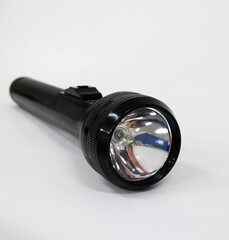Photo of a flashlight in black on a white background
