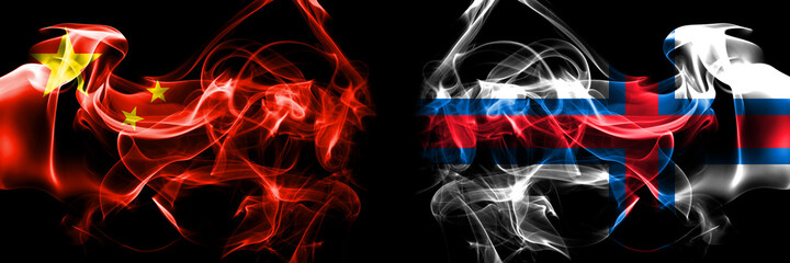 Flags of China, Chinese vs Faroe Islands, Faroese. Smoke flag placed side by side on black background.