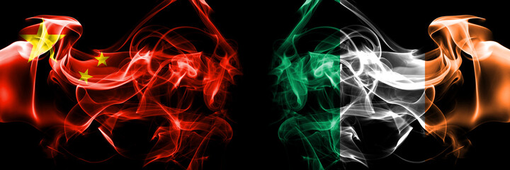 Flags of China, Chinese vs Ireland, Irish. Smoke flag placed side by side on black background.
