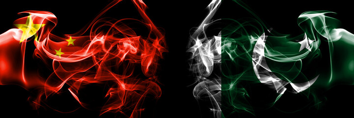 Flags of China, Chinese vs Pakistan, Pakistani. Smoke flag placed side by side on black background.