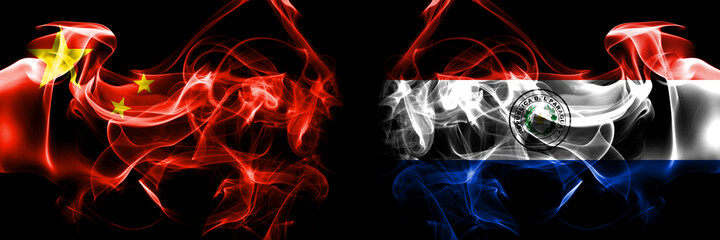 Flags of China, Chinese vs Paraguay, Paraguayan. Smoke flag placed side by side on black background.