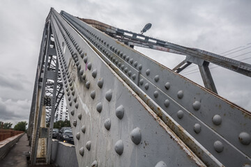 steel bridge supports with rivets. Gray bridge beams made of steel.