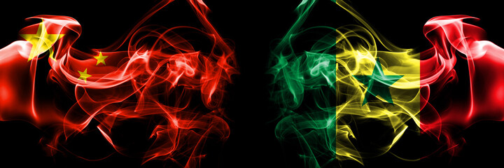 Flags of China, Chinese vs Senegal. Smoke flag placed side by side on black background.