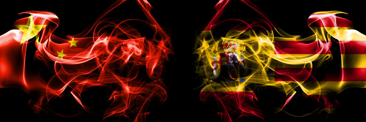 Flags of China, Chinese vs Spain, Catalonia, state. Smoke flag placed side by side on black background.